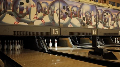 Bowling Pins Being Knocked Down by Bowling Ball Stock Footage 114016631