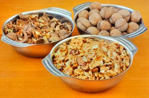 Bowls with walnuts Stock Photos
