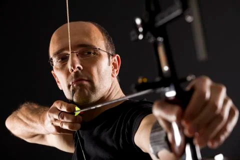 Bowman aiming, side view. Stock Photos