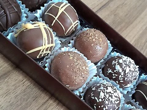 Box of assorted chocolates, close-up. Stock Photos