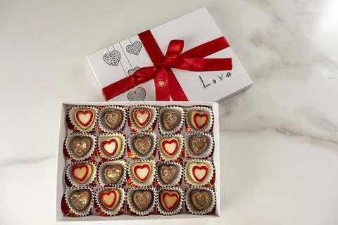 Box of assorted chocolates with the lid open top view. Stock Photos
