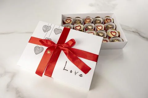 Box of assorted chocolates with the word love. Stock Photos