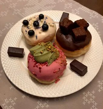 Box of assorted donuts ready for takeaway or delivery. Stock Photos