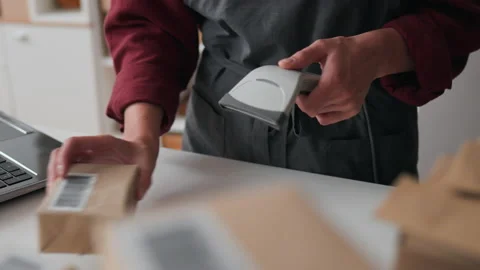 Box with a barcode, Packing shop worker In progress Holding an electronic sc Stock Footage 233817000