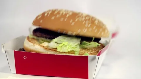 Box with a burger falling in slow motion Stock Footage 72621489