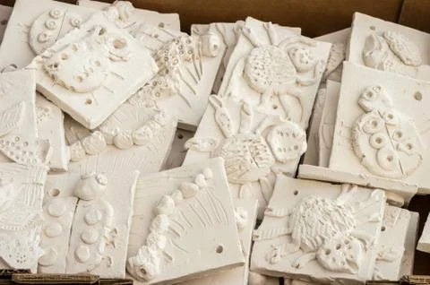 Box of ceramic tiles ready to be glazed. Stock-Fotos