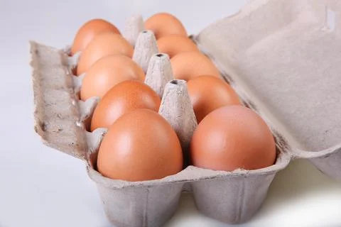 A box of chicken eggs. Closeup. Stock Photos
