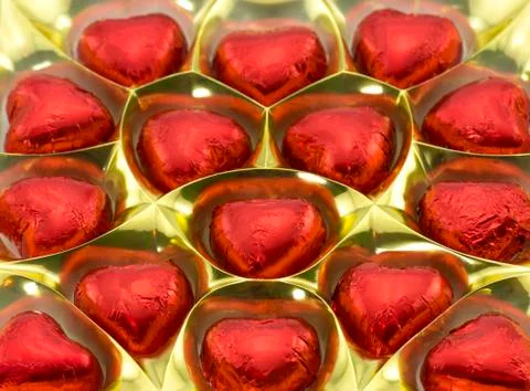 A box of chocolates in the shape of hearts Stock Photos