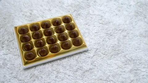 Box of chocolates sweets, close-up top view. Chocolate candy set. Stock Footage 240838343