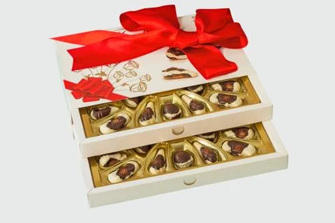 A box of chocolates on a white background. Stock Photos