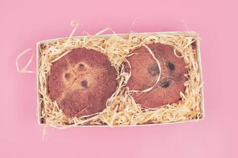 In a box coconut on a pink background isolate, copyspace, layout Stock Photos