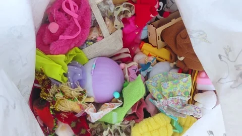 Box container with different child toys. Toys and crafts organized in a box. Stock Footage 324223517