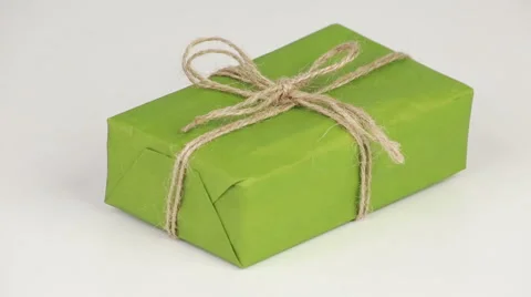 Box covered with green wrapping paper Stock Footage 58537873