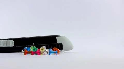 Box Cutter and Colored Push-Pins Stock Footage 59826264