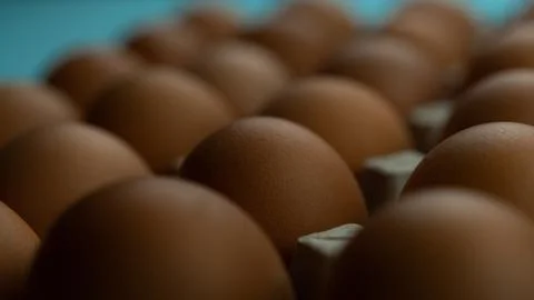 A box of eggs on a blue background Stock Photos