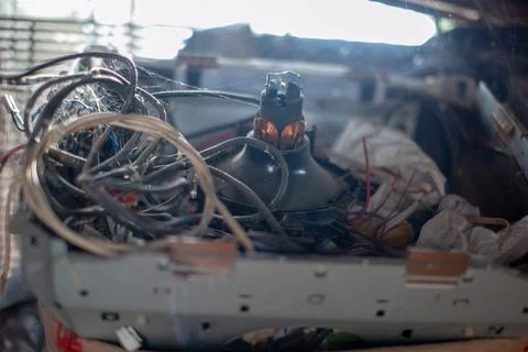 Box with electronic waste, outdated technology, cathode ray tube and coils of Fotos de archivo