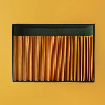 Box with envelopes. Box with discs on an orange background. Top view Stock Photos