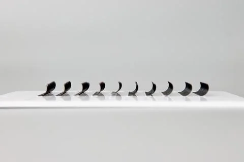 Box with false eyelashes on a gray background Stock Photos