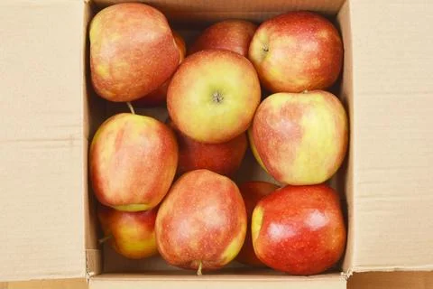 Box filled with apples Stock Photos