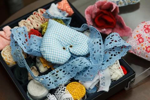 Box is filled with multicolored tapes for handmade Stock Photos