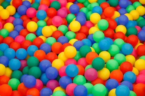 Box filled with small colored balls Stock Photos