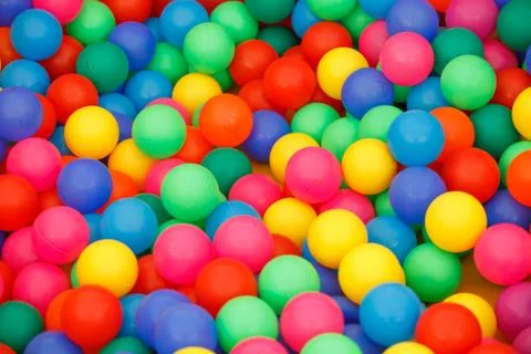 Box filled with small colored balls Stock-Fotos