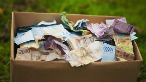 Box Full of Donation Money in Rupiah Stock Footage 345551296
