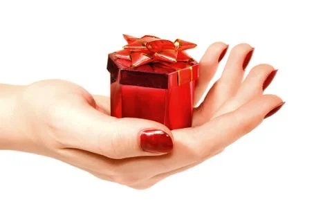Box with a gift in hand Stock Photos