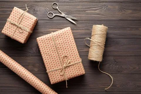 Box with a gift, wrapping paper, scissors, twine. table ideas for  gift Stock Photos