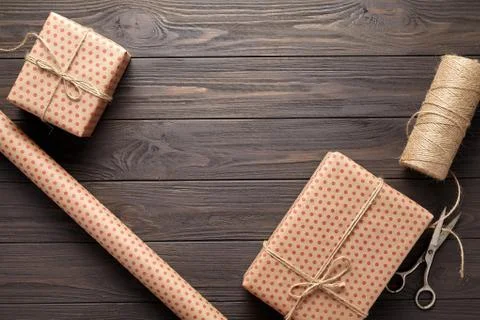 Box with a gift, wrapping paper, scissors, twine. table ideas for gifts Stock Photos