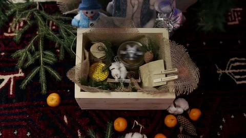Box with gifts is under the tree Stock Footage 76984346