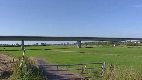 Box girder bridge spanning the river IJssel + floodplains near Zutphen Stock Footage 150047580