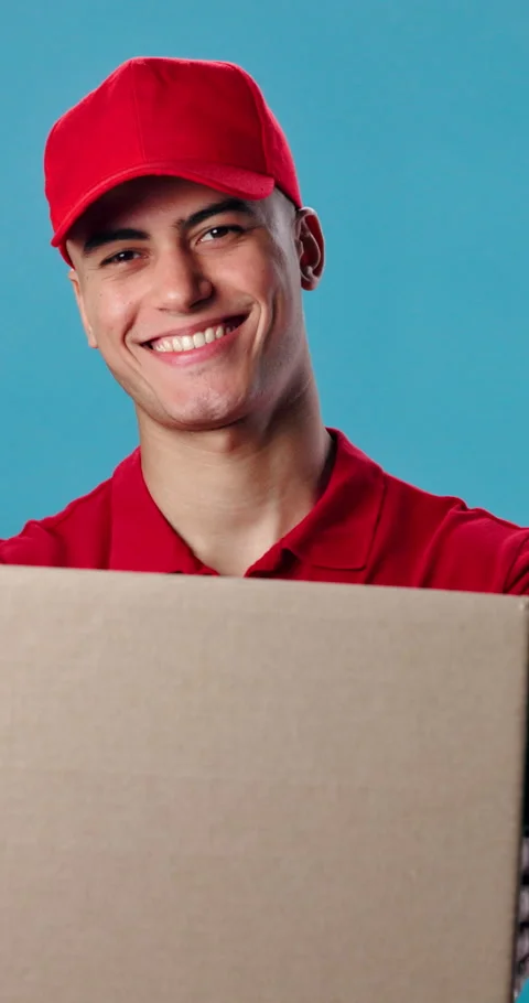 Box, happy and face of delivery man in studio with confidence for export courier Stock Footage 343199636