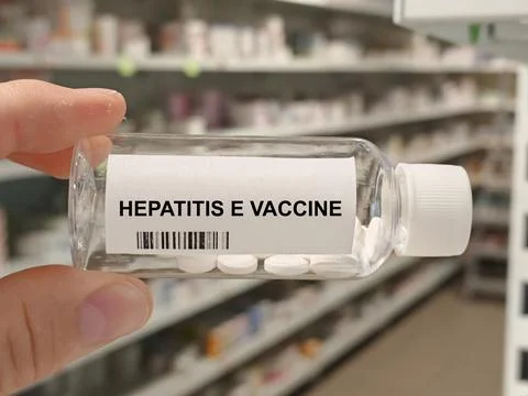 Box of HEPATITIS E VACCINE tablets on a hospital pharmacy table used to prevent Stock Photos