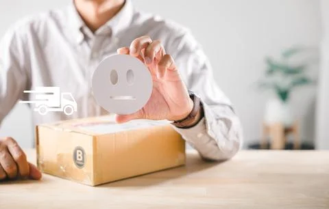 Box highlights customer experience feedback, person holds neutral face icon.. Stock Photos