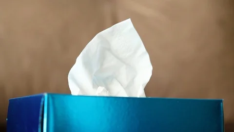 Box hygiene napkins on the brown sofa. Stock Footage 115477818