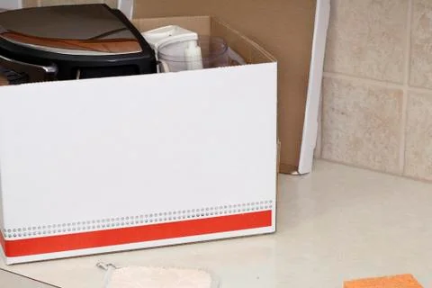 Box of items to sell Stock Photos