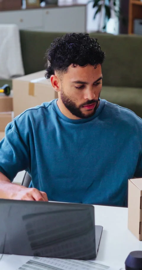 Box, laptop and remote work with man in home office for delivery, distribution Stock Footage 338224146