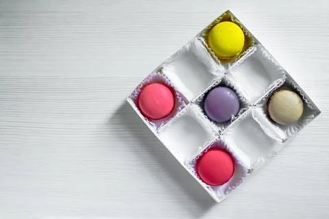 Box with macarons cookies isolated on white background. Stock Photos