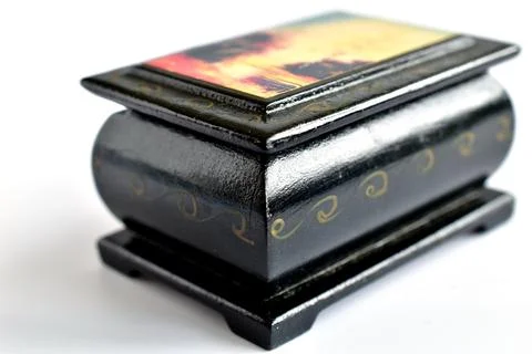 A box made of black wood with a pattern on the lid. Stock Photos