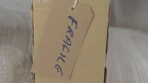Box marked as fragile with tag Stock Footage 112925994