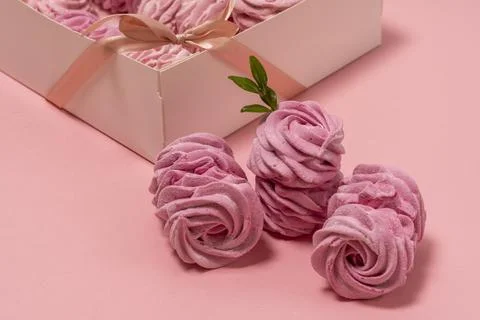 Box with marshmallows. pink background. pink marshmallows. space for text Stock Photos