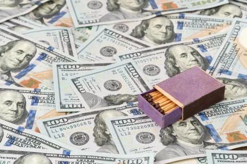 Box with matches on dollars Stock Photos