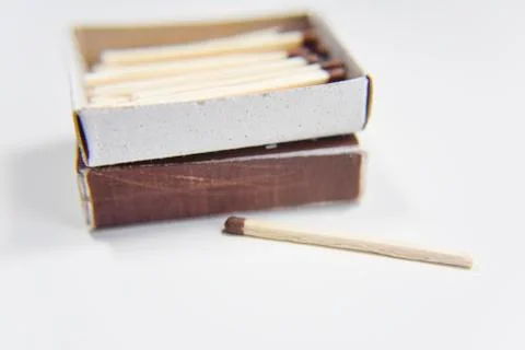 Box of matches on the white background and one outside Stock Photos