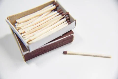 Box of matches on the white background and one outside Stock Photos