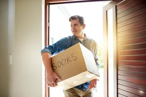 Box, moving and man by door of home for property evaluation, market value or Stock Photos
