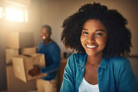 Box, moving day and portrait of woman in home with man for packing or relocation Stock Photos