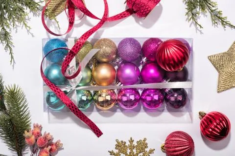 Box of multi-colored baubles. Stock Photos