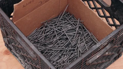 Box of Nails on Construction Site Work Surface Stock Footage 345175623