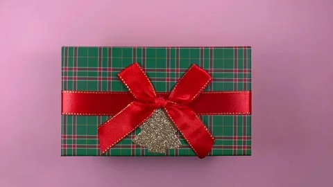A box with a New Year's gift appears in the frame, stop motion Stock Footage 249622312